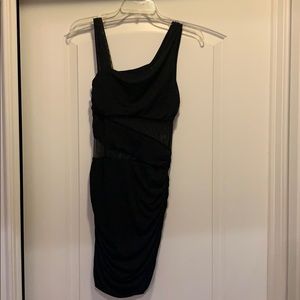 Tight black dress with sheer cut outs
